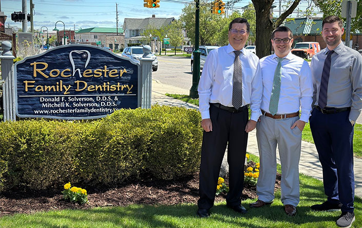 Drs Don, Mitch & Alec in front of office sign